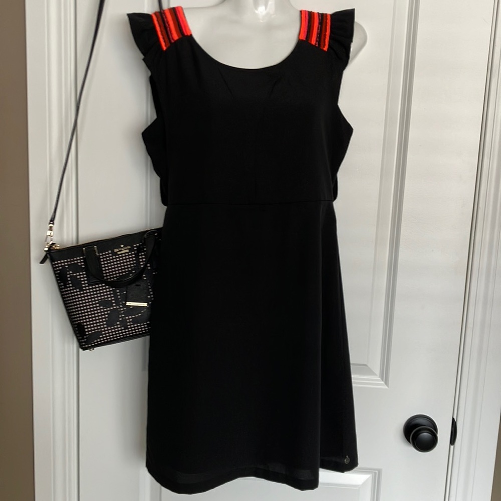 Just listed💕 stunning LBD with cute ruffle detail at shouldera and open back.